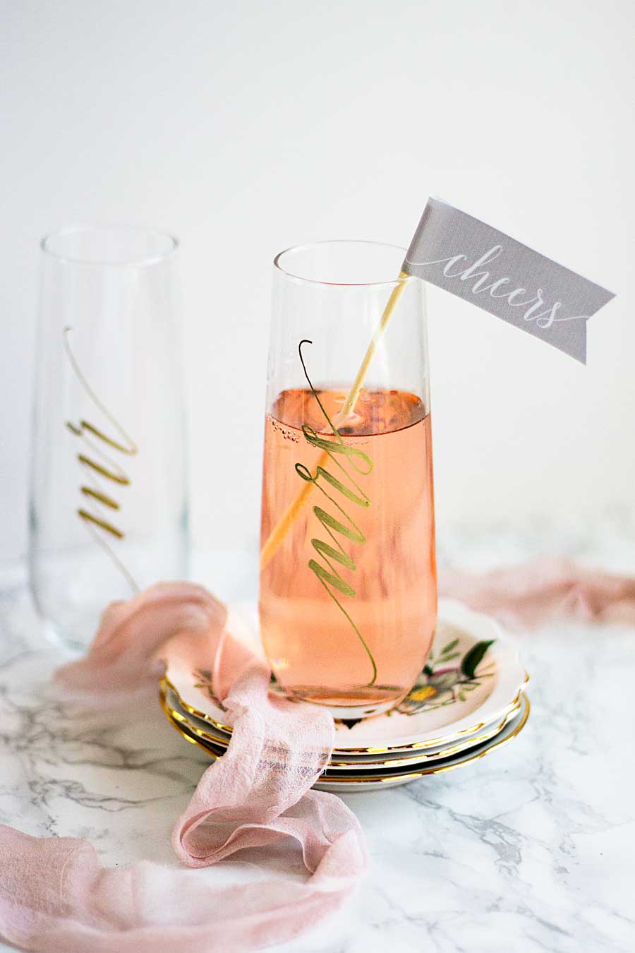 Make these fun and festive wedding champagne flutes for your own wedding or to give as gifts to all your friends. All you need are glasses and paint pen! Wedding champagne glasses. DIY wedding champagne flutes. Mr and Mrs champagne glasses.